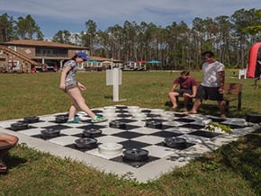 Play outdoor lawn checkers and giant connect 4